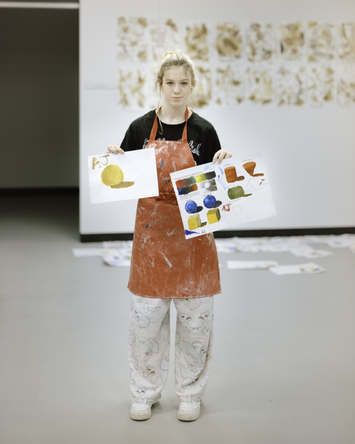 Claudia Caporn: AJ, holding up her finished work (Year 9 Art Class), 2022