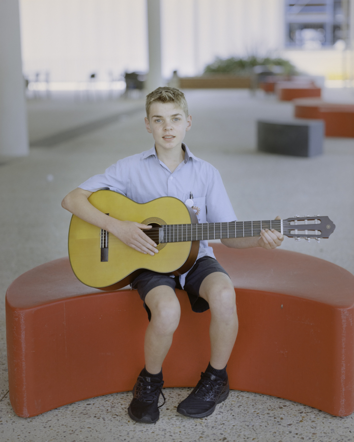 Claudia Caporn: Jesse, playing guitar (Lunch), 2022