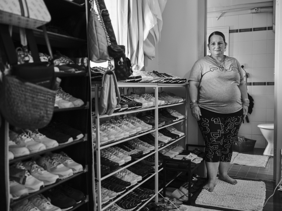 Duncan Wright: Tammy with her collection of Nike TN's, slides and high-end bags, 2023